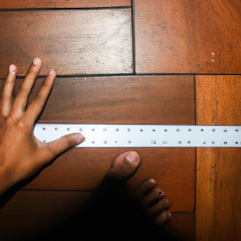 Person measuring feet with ruler
