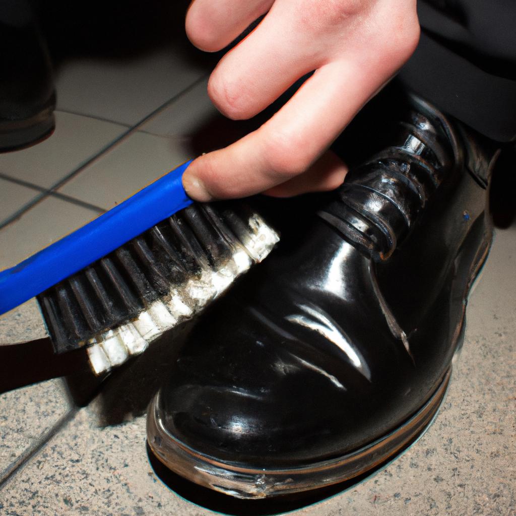Person cleaning shoes with brush