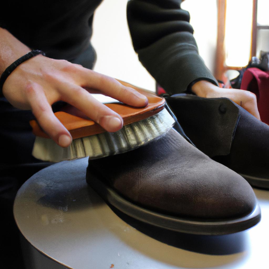 Person polishing leather shoes professionally